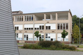 Firma z budovy E2 vyřezává okna. Foto: Adam Pluhař